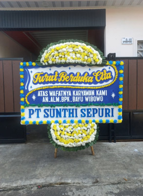 Papan Bunga Duka di Tengkurak