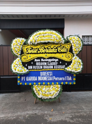 Papan Bunga Duka di Tengkurak